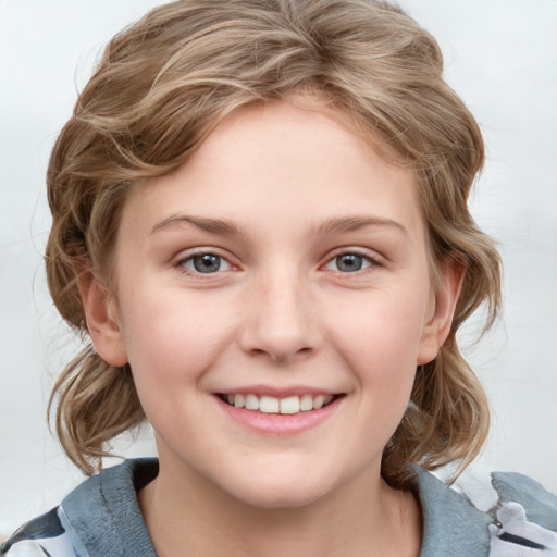 Joyful white child female with medium  brown hair and grey eyes