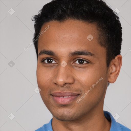 Joyful black young-adult male with short  black hair and brown eyes