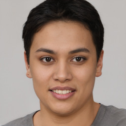 Joyful asian young-adult female with short  black hair and brown eyes