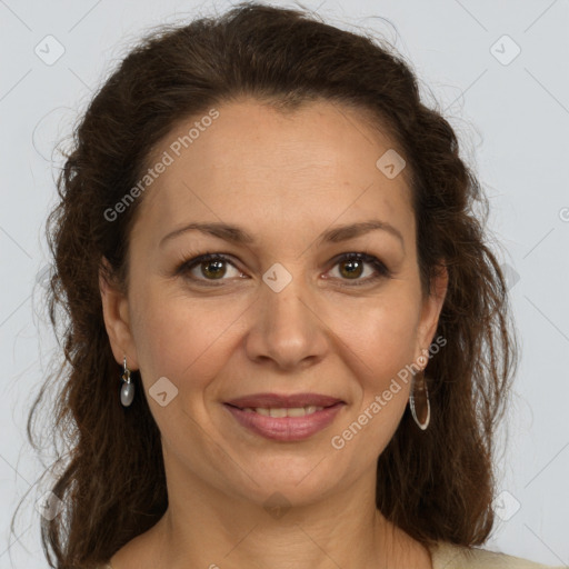 Joyful white adult female with long  brown hair and brown eyes