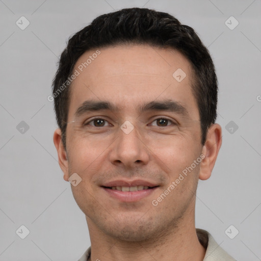 Joyful white young-adult male with short  black hair and brown eyes