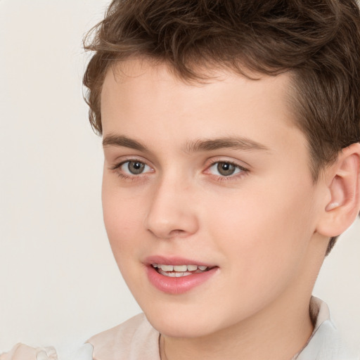 Joyful white child male with short  brown hair and brown eyes