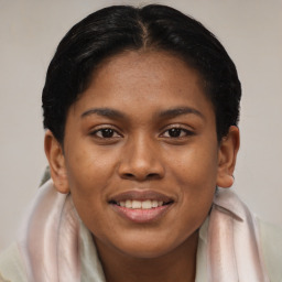 Joyful latino young-adult female with short  brown hair and brown eyes