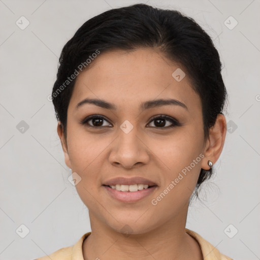 Joyful latino young-adult female with short  brown hair and brown eyes