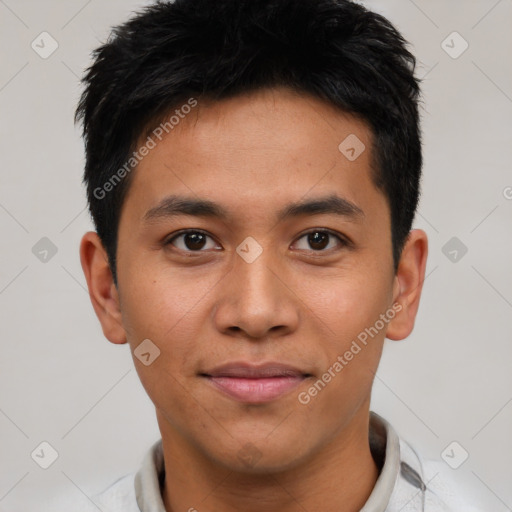 Joyful asian young-adult male with short  black hair and brown eyes