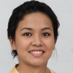 Joyful asian young-adult female with short  brown hair and brown eyes