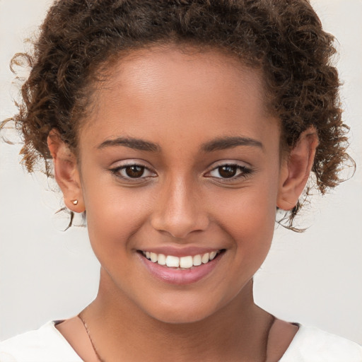 Joyful white child female with short  brown hair and brown eyes