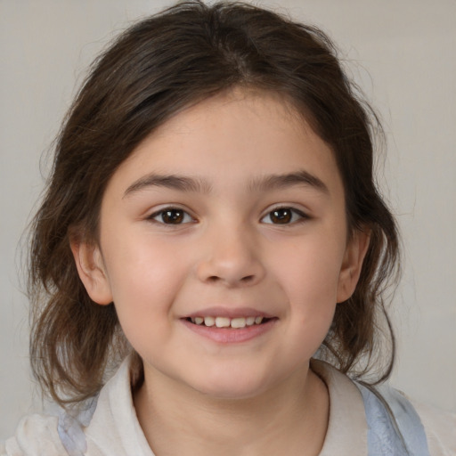 Joyful white child female with medium  brown hair and brown eyes