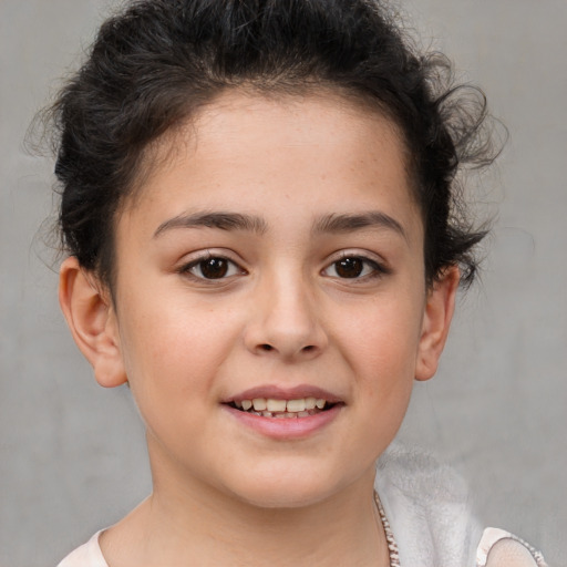 Joyful white child female with short  brown hair and brown eyes