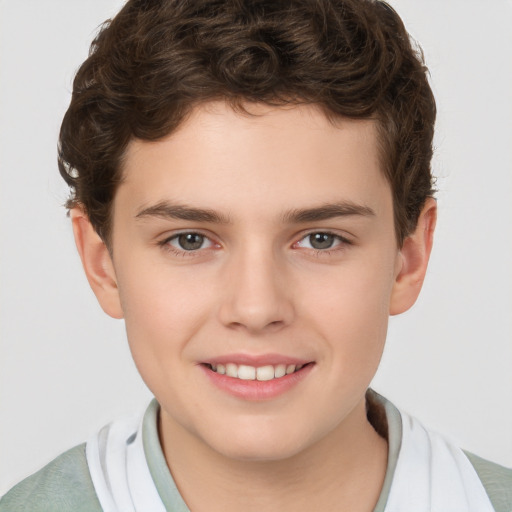 Joyful white child male with short  brown hair and brown eyes