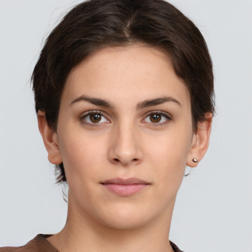 Neutral white young-adult female with short  brown hair and brown eyes