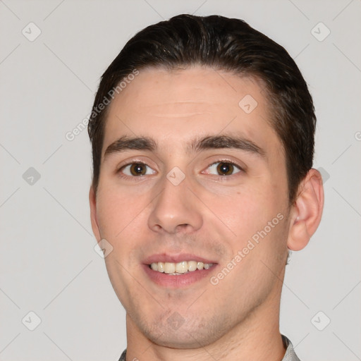 Joyful white young-adult male with short  brown hair and brown eyes