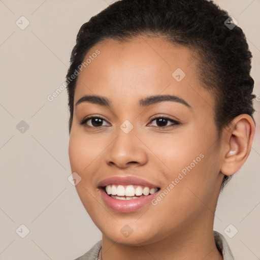 Joyful latino young-adult female with short  brown hair and brown eyes