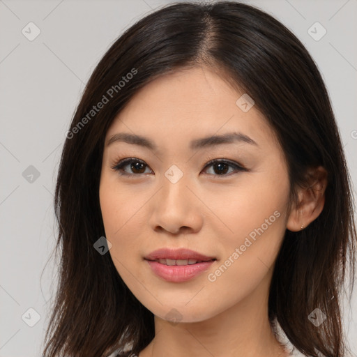 Joyful asian young-adult female with long  brown hair and brown eyes