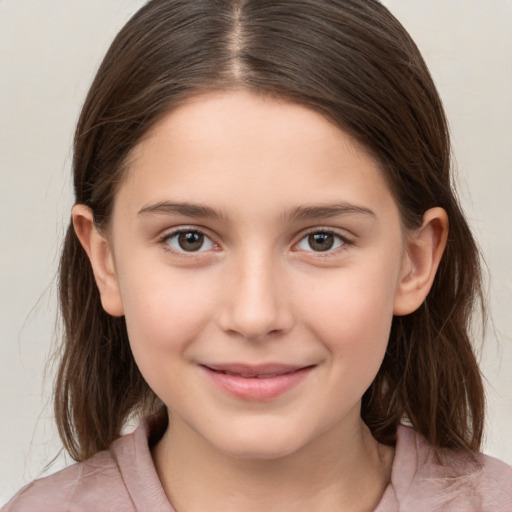 Joyful white child female with medium  brown hair and brown eyes