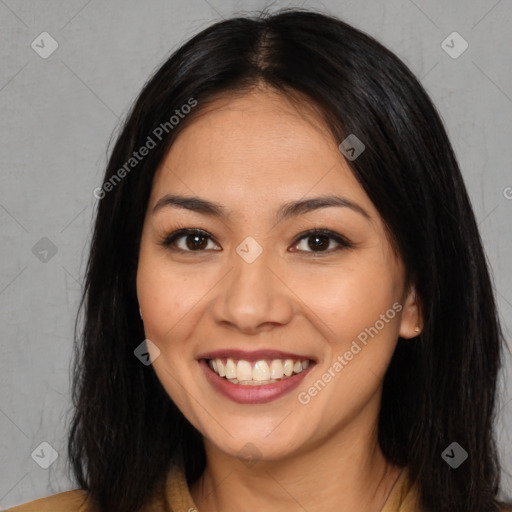 Joyful asian young-adult female with long  brown hair and brown eyes