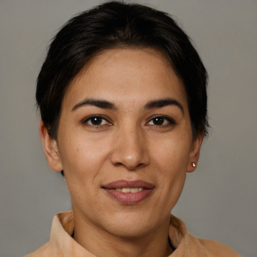 Joyful latino young-adult female with short  brown hair and brown eyes