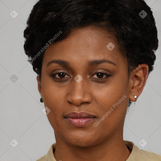 Joyful black young-adult female with short  brown hair and brown eyes