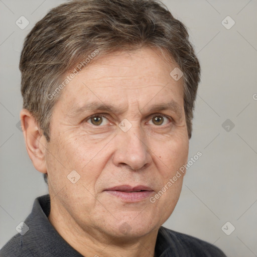 Joyful white middle-aged male with short  brown hair and grey eyes