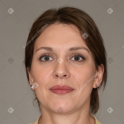 Joyful white adult female with medium  brown hair and brown eyes