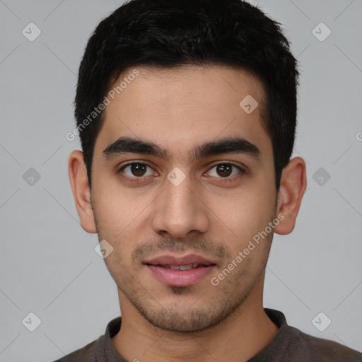 Joyful white young-adult male with short  black hair and brown eyes