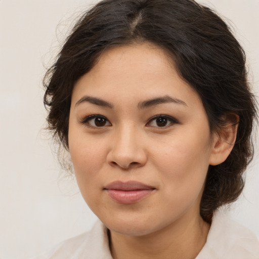 Joyful asian young-adult female with medium  brown hair and brown eyes