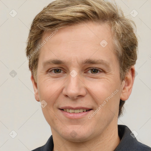 Joyful white adult male with short  brown hair and grey eyes