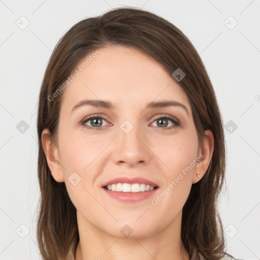 Joyful white young-adult female with long  brown hair and grey eyes