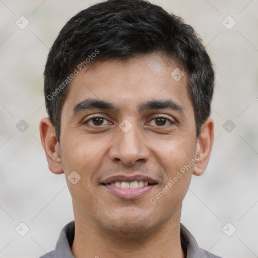 Joyful latino young-adult male with short  black hair and brown eyes