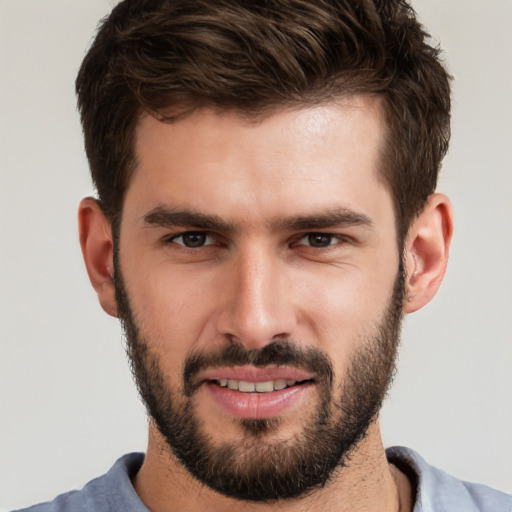 Joyful white young-adult male with short  brown hair and brown eyes