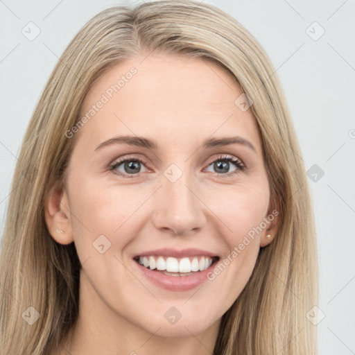 Joyful white young-adult female with long  brown hair and grey eyes