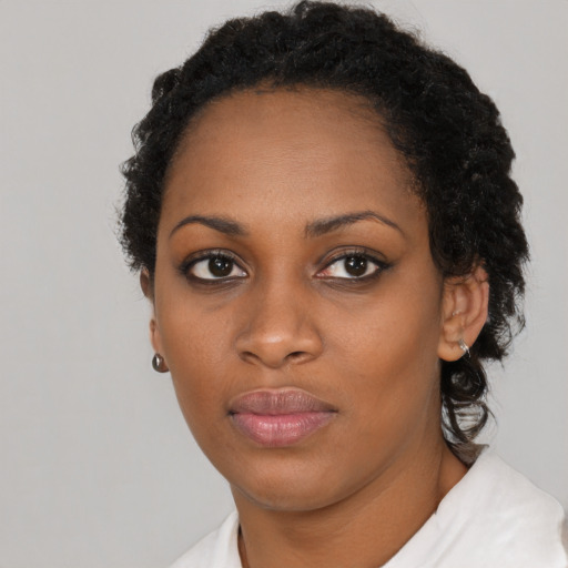 Neutral black young-adult female with short  black hair and brown eyes