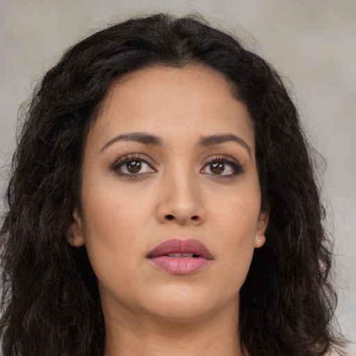 Neutral latino young-adult female with long  brown hair and brown eyes