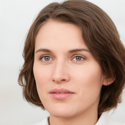 Neutral white young-adult female with medium  brown hair and green eyes