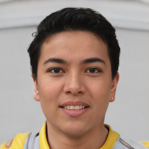 Joyful asian young-adult male with short  brown hair and brown eyes