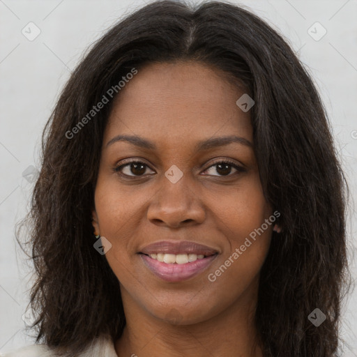 Joyful black young-adult female with long  brown hair and brown eyes