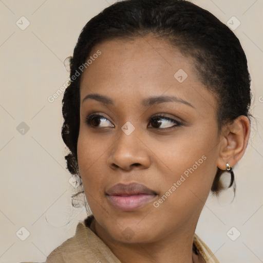 Joyful black young-adult female with short  brown hair and brown eyes