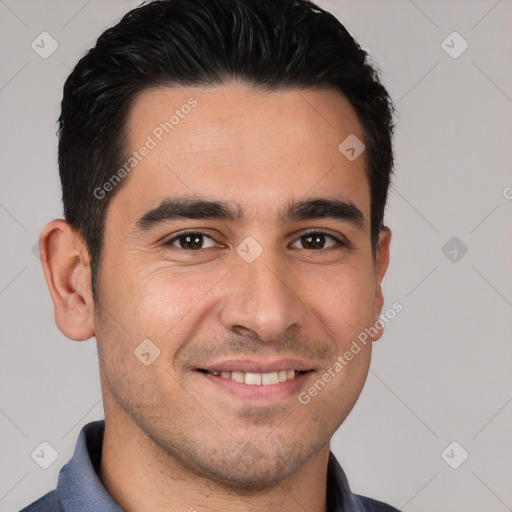 Joyful white young-adult male with short  black hair and brown eyes