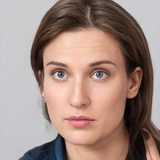 Neutral white young-adult female with medium  brown hair and grey eyes