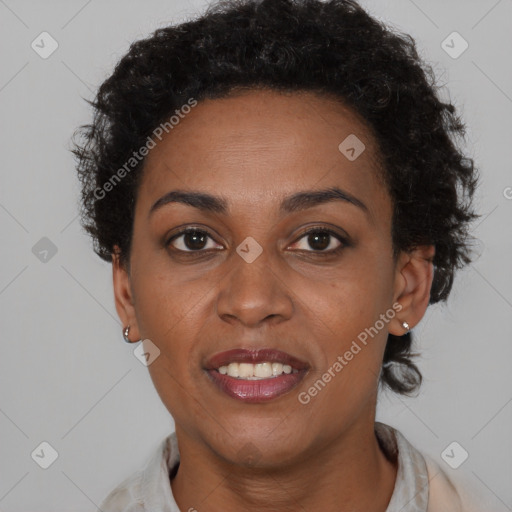 Joyful black adult female with short  brown hair and brown eyes