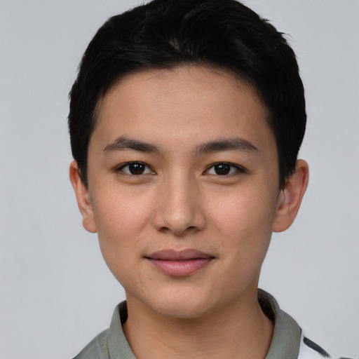 Joyful asian young-adult male with short  black hair and brown eyes