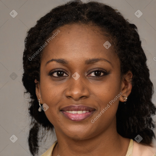 Joyful black young-adult female with medium  brown hair and brown eyes