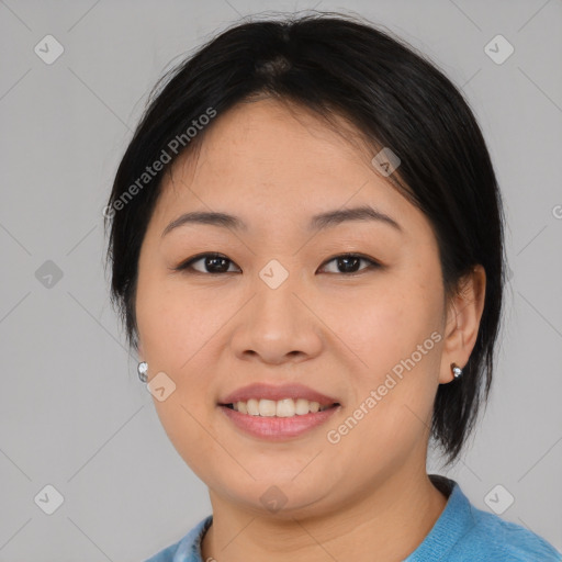 Joyful asian young-adult female with medium  brown hair and brown eyes