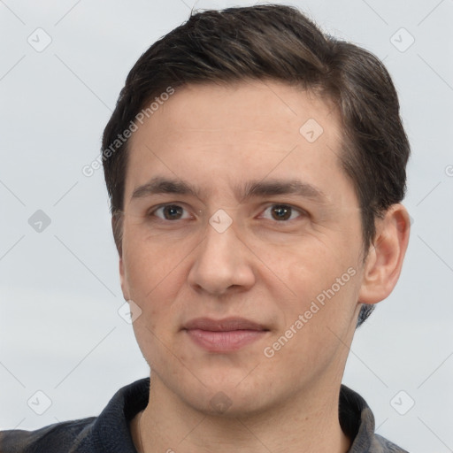 Joyful white adult male with short  brown hair and brown eyes