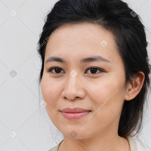 Joyful asian young-adult female with medium  brown hair and brown eyes