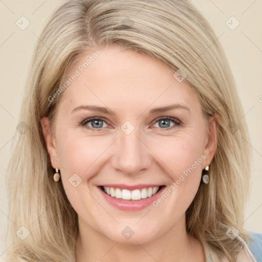 Joyful white young-adult female with long  brown hair and blue eyes