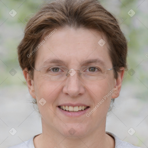 Joyful white adult female with short  brown hair and brown eyes