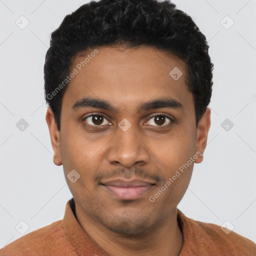 Joyful black young-adult male with short  black hair and brown eyes