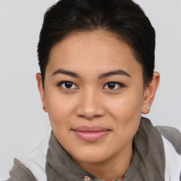 Joyful asian young-adult female with short  brown hair and brown eyes