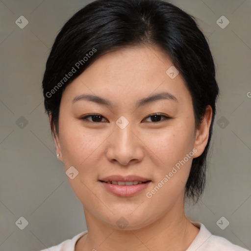 Joyful asian young-adult female with medium  brown hair and brown eyes